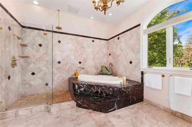 6901 E 12th Ave, Denver, CO 80220 - full bathroom featuring healthy amount of natural light, a bath, a tile shower, marble finish floors, and recessed lighting