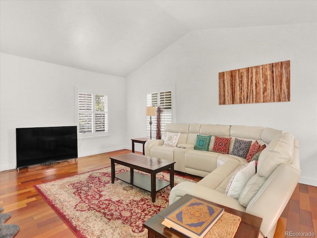 3596 S Telluride Way, Aurora, CO 80013 - living room featuring lofted ceiling and wood finished floors