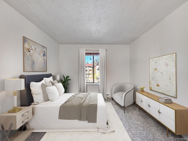 carpeted bedroom with a textured ceiling