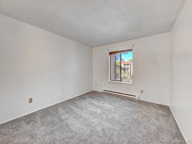 carpeted spare room featuring a textured ceiling and a baseboard heating unit