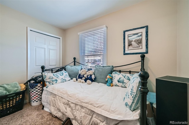 carpeted bedroom with a closet