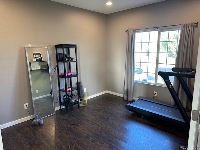 workout room with dark wood-type flooring