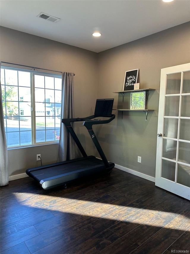 exercise area with dark hardwood / wood-style floors