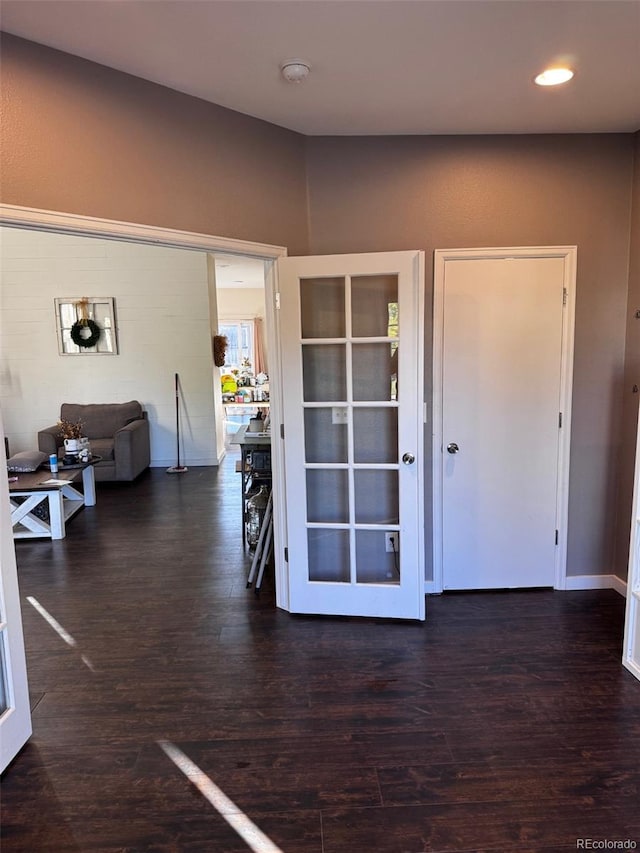 foyer entrance featuring dark hardwood / wood-style floors