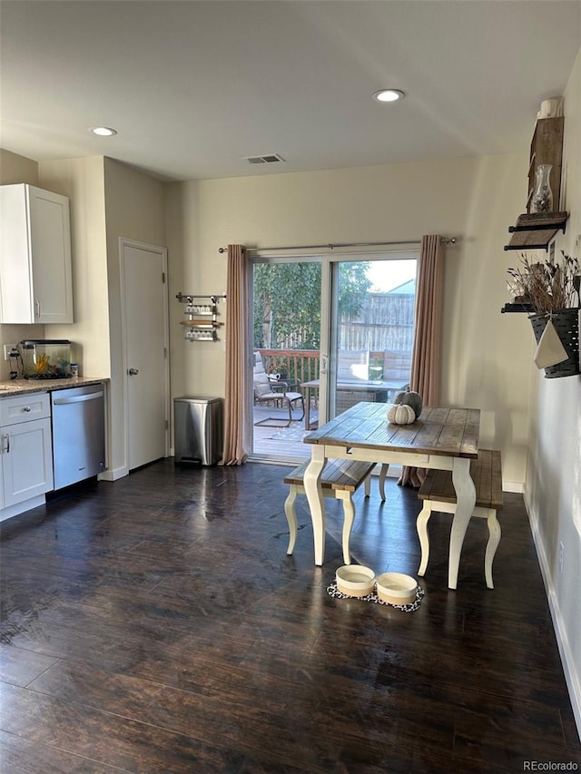 dining area with dark hardwood / wood-style flooring