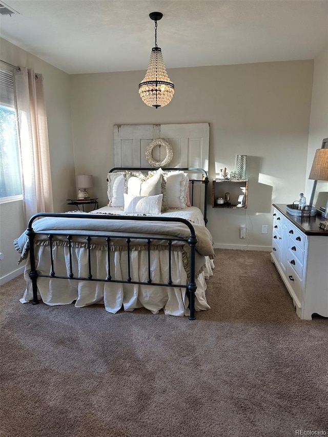 bedroom with dark colored carpet