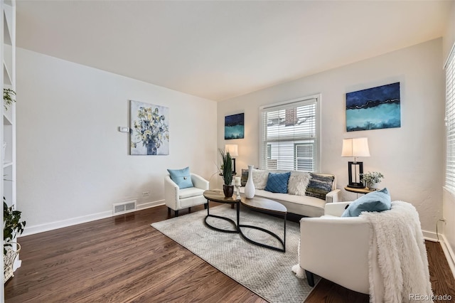 living room with dark hardwood / wood-style flooring