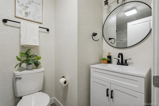 6193 Holland St, Arvada, CO 80004 - bathroom featuring vanity and a textured wall