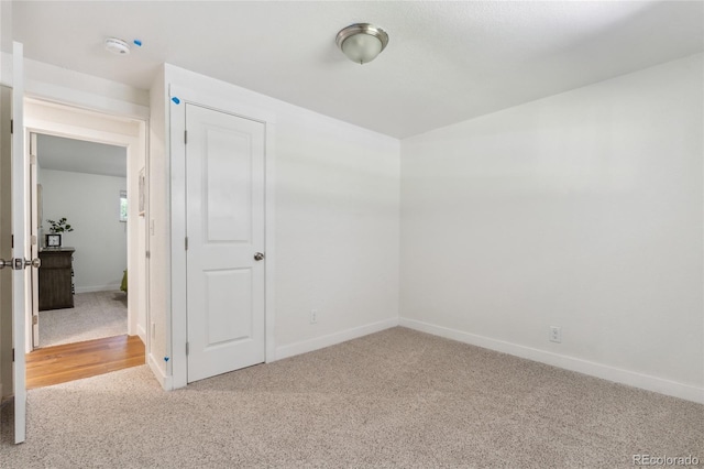 6193 Holland St, Arvada, CO 80004 - empty room with carpet floors and a smoke detector
