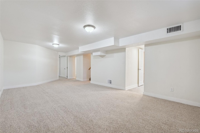 6193 Holland St, Arvada, CO 80004 - finished below grade area with light carpet and stairs