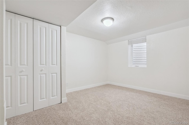 6193 Holland St, Arvada, CO 80004 - unfurnished bedroom featuring carpet floors, a closet, and a textured ceiling