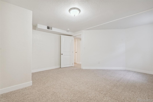 6193 Holland St, Arvada, CO 80004 - spare room with carpet flooring and a textured ceiling