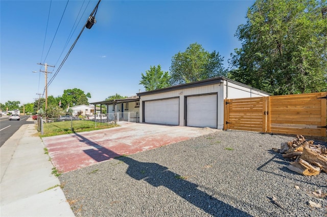 6193 Holland St, Arvada, CO 80004 - view of front of house with a gate and a detached garage
