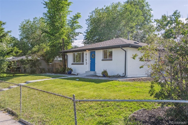 6193 Holland St, Arvada, CO 80004 - view of front of home with a fenced backyard and roof with shingles