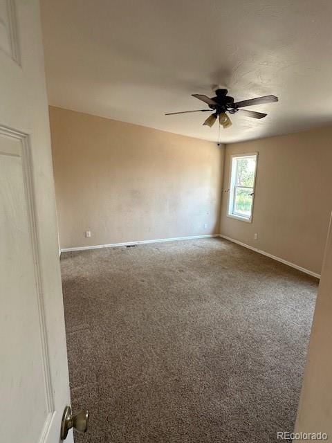 13193 E US Highway 160, Alamosa, CO 81101 - carpeted spare room featuring ceiling fan and baseboards