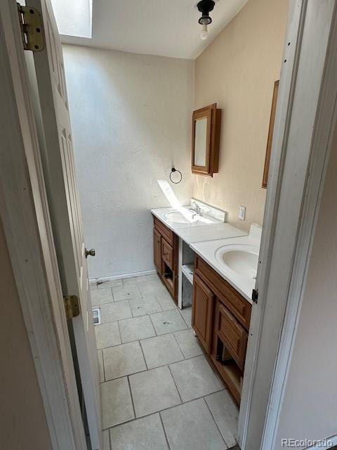 13193 E US Highway 160, Alamosa, CO 81101 - bathroom with vanity and tile patterned floors