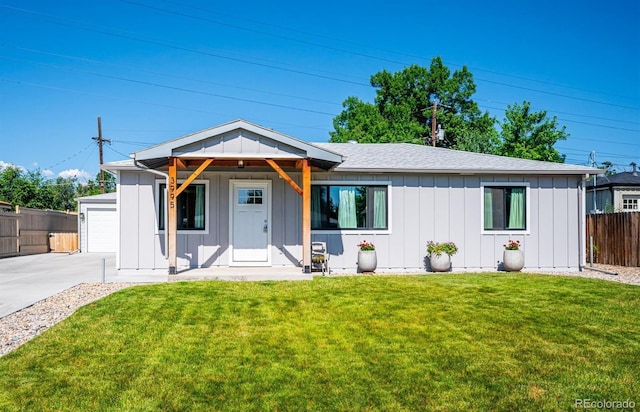 3995 Nelson St, Wheat Ridge, CO 80033 - view of front of house with board and batten siding and driveway