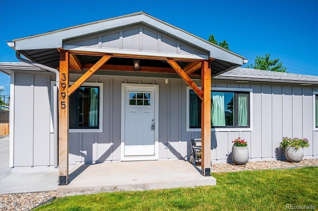 3995 Nelson St, Wheat Ridge, CO 80033 - entrance to property with board and batten siding and a yard