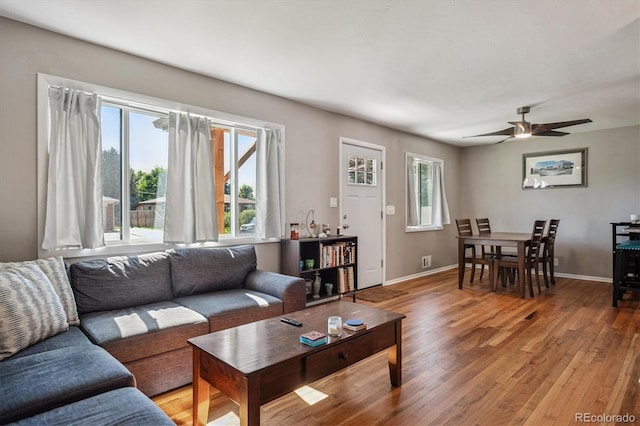 3995 Nelson St, Wheat Ridge, CO 80033 - living area with light wood-style flooring and a ceiling fan