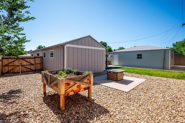3995 Nelson St, Wheat Ridge, CO 80033 - view of patio with an outbuilding and a gate