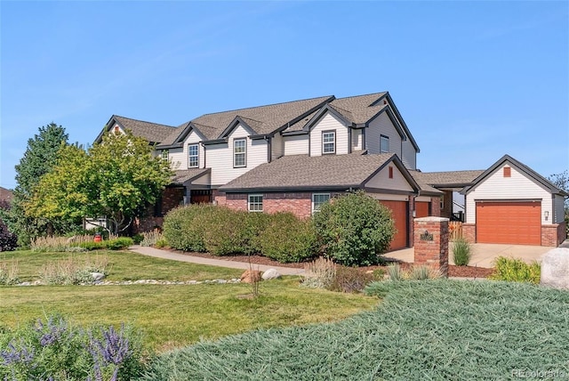 view of front of property with a garage and a front lawn