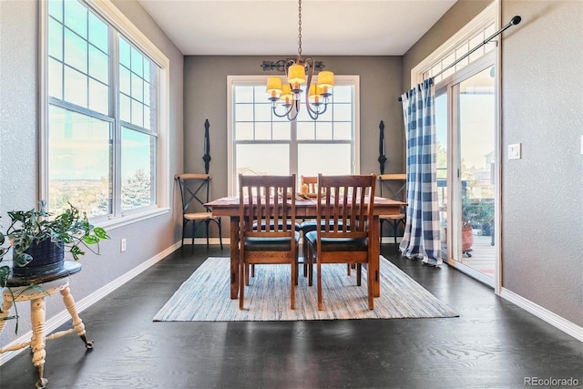 dining area featuring an inviting chandelier