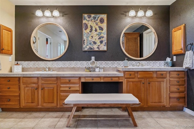 bathroom featuring tile patterned flooring and vanity