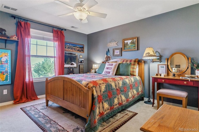 bedroom with multiple windows, ceiling fan, and light colored carpet