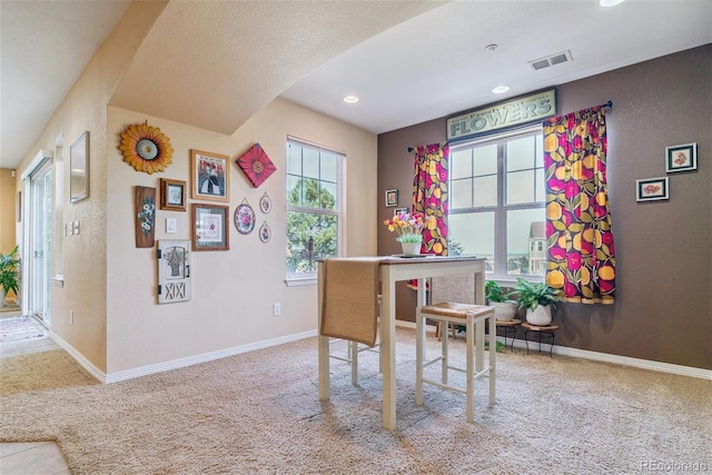 office area with a textured ceiling and carpet