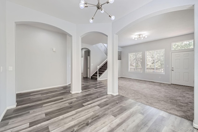 interior space featuring an inviting chandelier and hardwood / wood-style floors