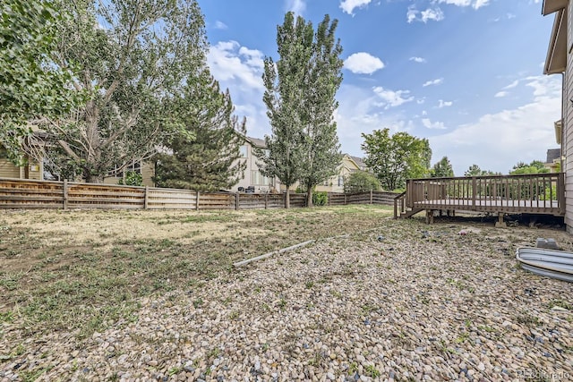 view of yard with a wooden deck