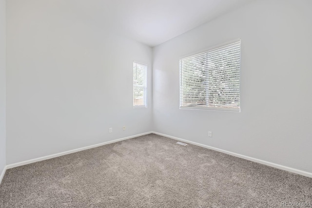 unfurnished room with carpet