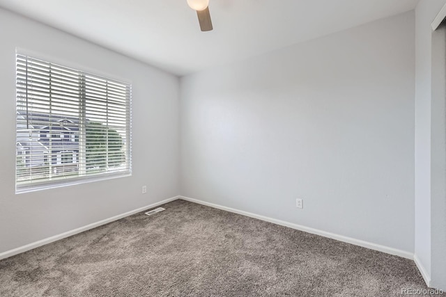 unfurnished room with ceiling fan and carpet flooring