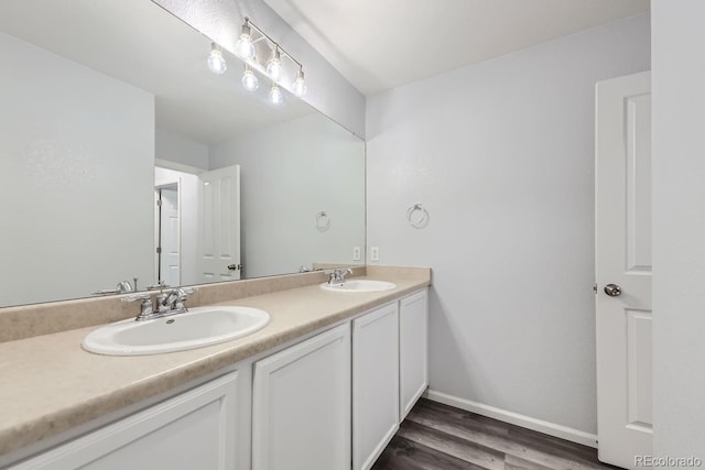 bathroom with vanity and wood-type flooring