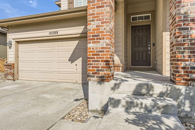 view of exterior entry featuring a garage