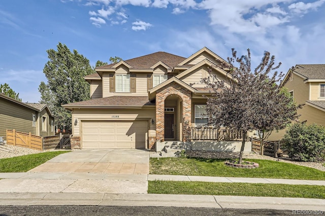 view of front of property with a garage and a front yard