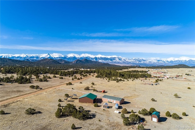 birds eye view of property featuring a mountain view