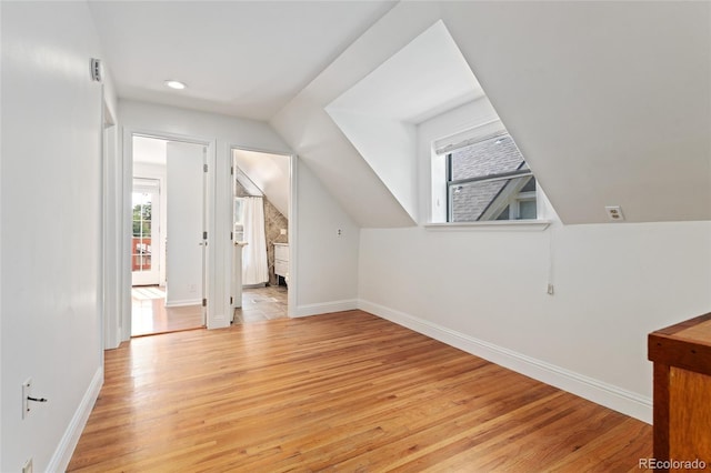 2829 N Franklin St, Denver, CO 80205 - additional living space with light wood-type flooring, vaulted ceiling, and recessed lighting