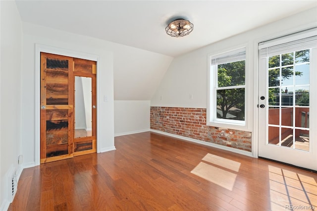 2829 N Franklin St, Denver, CO 80205 - additional living space featuring wood finished floors and lofted ceiling