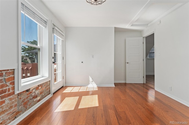 2829 N Franklin St, Denver, CO 80205 - empty room featuring wood finished floors and baseboards