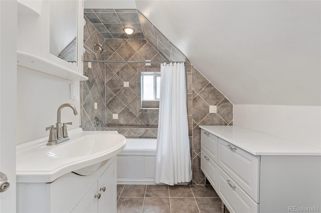 2829 N Franklin St, Denver, CO 80205 - full bath featuring tiled shower / bath combo, vanity, tile patterned floors, and tile walls