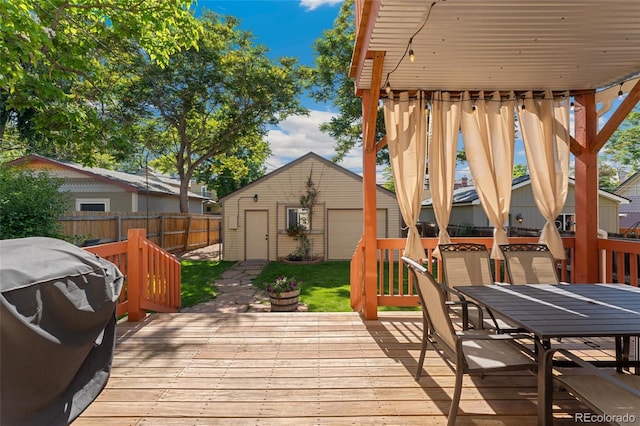 2829 N Franklin St, Denver, CO 80205 - deck featuring an outbuilding, outdoor dining space, a garage, and grilling area