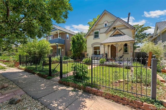 2829 N Franklin St, Denver, CO 80205 - victorian home featuring a fenced front yard
