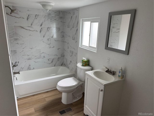 4807 Clayton St, Denver, CO 80216 - bathroom featuring vanity, wood finished floors, and washtub / shower combination