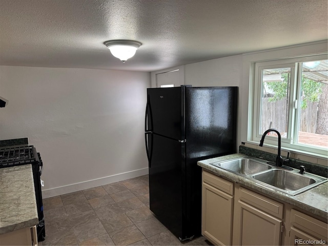 4807 Clayton St, Denver, CO 80216 - kitchen featuring a textured ceiling and black appliances