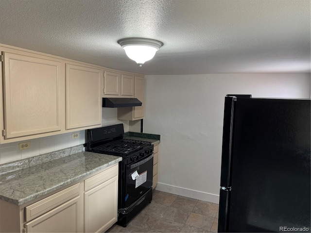 4807 Clayton St, Denver, CO 80216 - kitchen with black appliances, light countertops, under cabinet range hood, and a textured ceiling