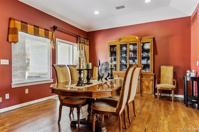 dining space with visible vents, recessed lighting, baseboards, and wood finished floors