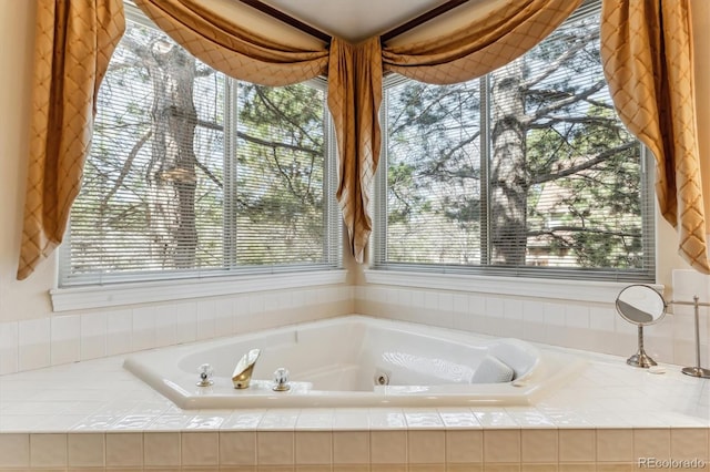 full bath featuring a tub with jets