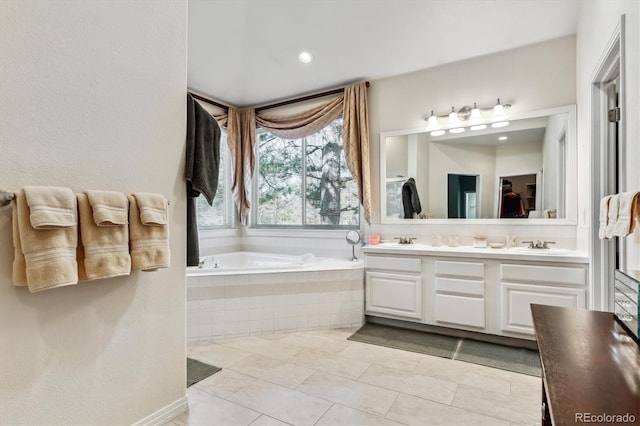 full bathroom featuring a bath, a sink, tile patterned flooring, and double vanity