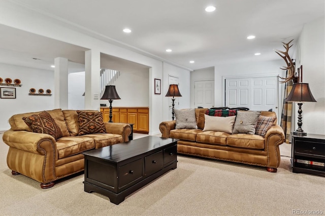 living room with recessed lighting and light colored carpet